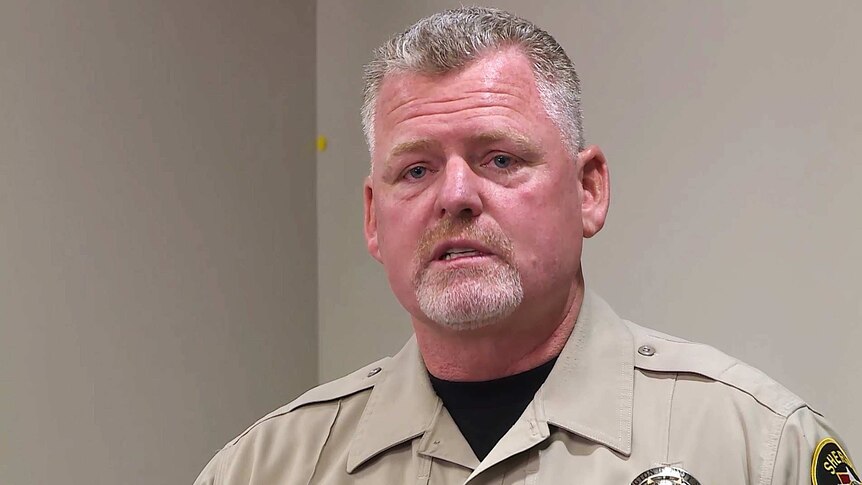 Headshot of Washington County Sheriff's Sergeant Aaron Thompson wearing his uniform at a press conference.