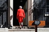 Theresa May walks away after announcing her resignation, outside 10 Downing Street in London