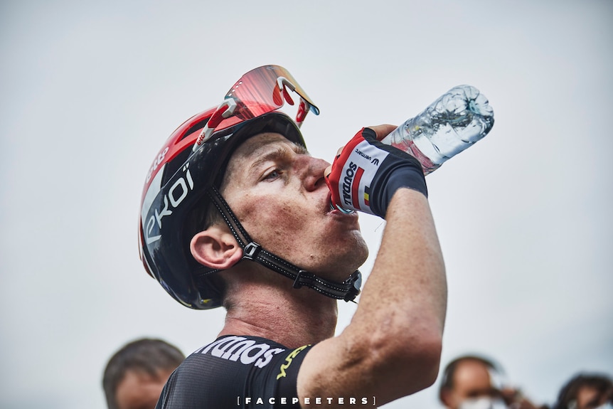 Bicyle racer Harry Sweeny taking a drink of water during his first Tour de France