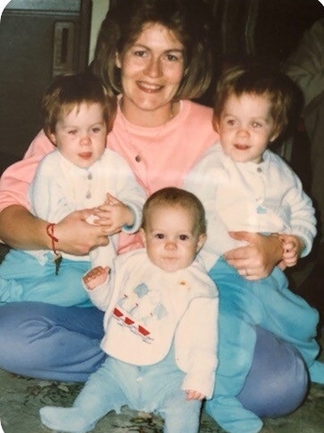 Delphine Murphy with her three children when they are young toddlers.