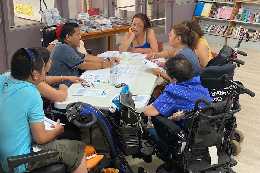 Multicultural Disability advocates in a group discussion about capabilities and support needs in emergencies.