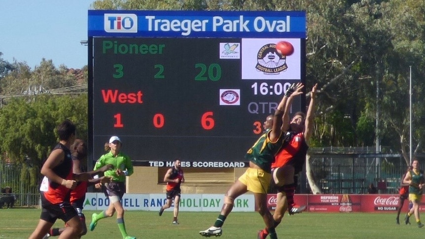 Two footy teams play at Traeger Park