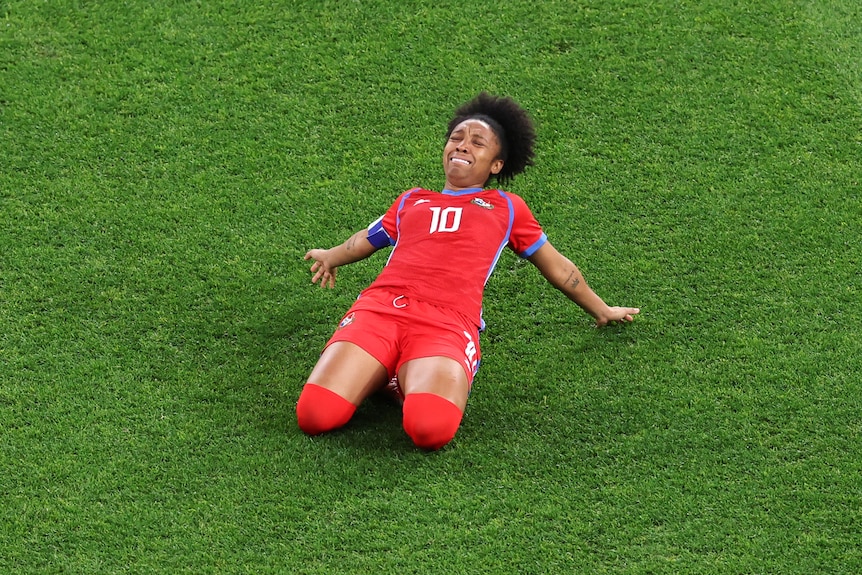 Panama's Marta Cox slides on her knees to celebrate a goal at the FIFA Women's World Cup.
