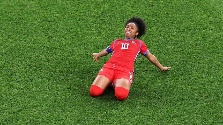 Panama's Marta Cox slides on her knees to celebrate a goal at the FIFA Women's World Cup.