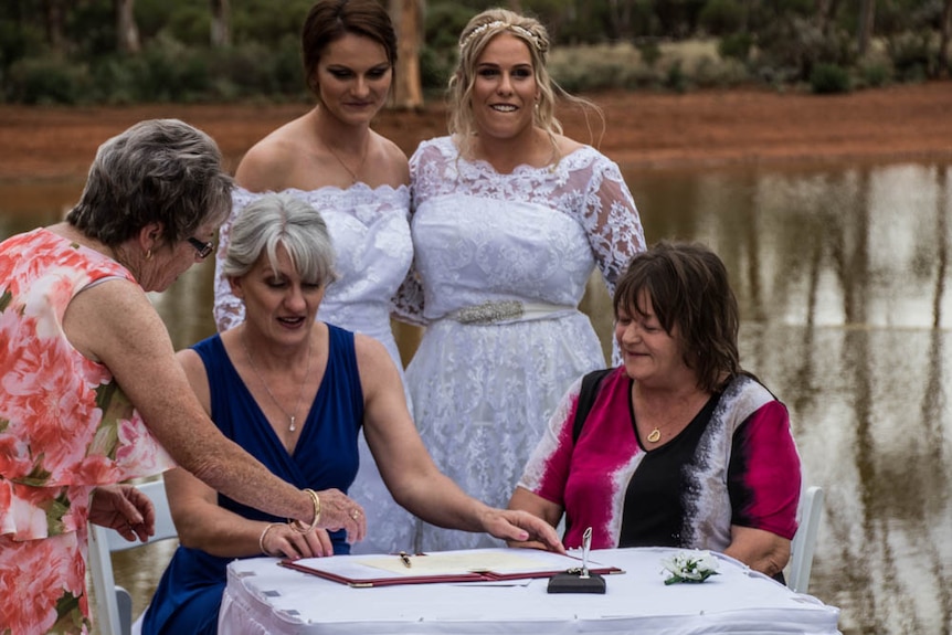 Same-sex wedding signing registry book