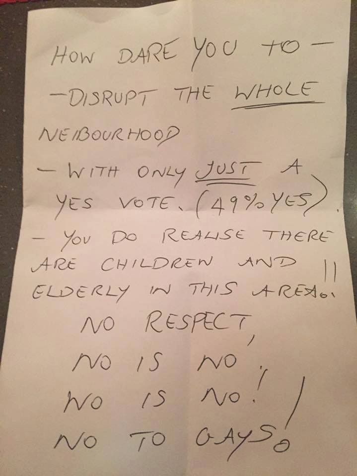 A handwritten note saying: how dare you disrupt the whole neighbourhood./ you do realise there are children and elderly in area