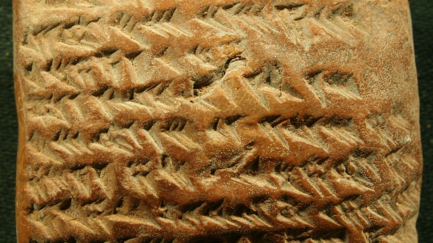 Image of ancient Babylonian clay tablet with cuneiform writing.