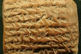 Image of ancient Babylonian clay tablet with cuneiform writing.