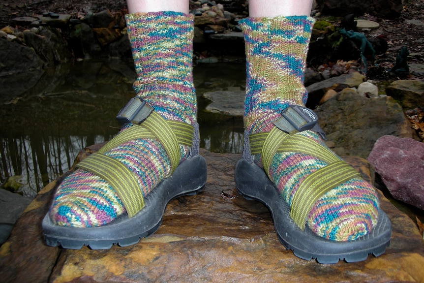 Colourful woollen socks and canvas strap sandals.