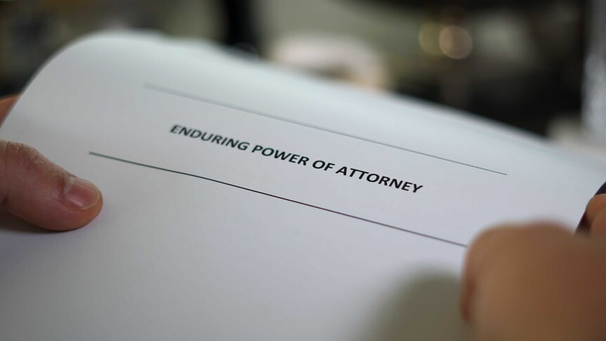 A close-up picture of an enduring power of attorney form being held by someone