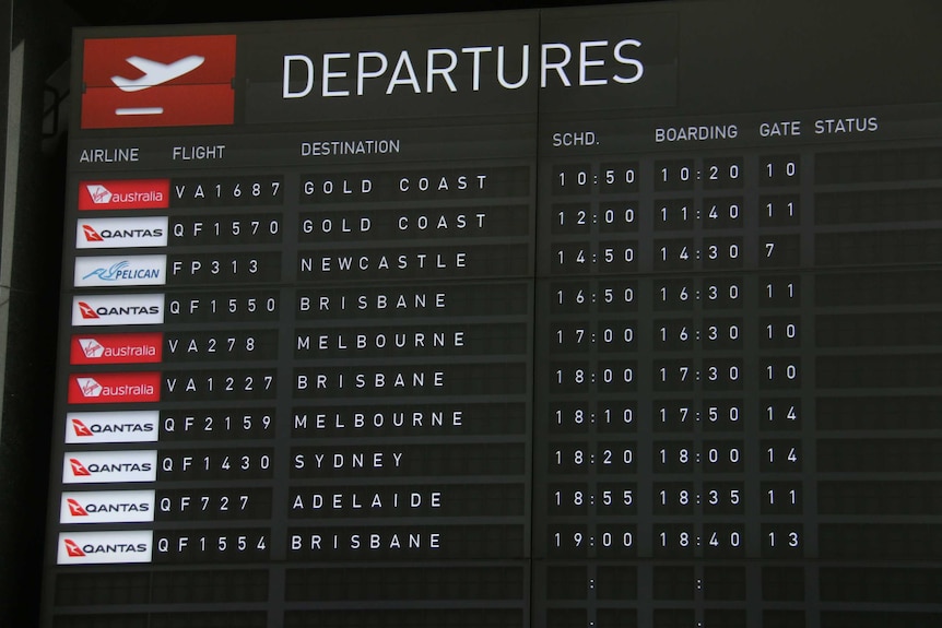 An airport screen shows flights to Queensland.