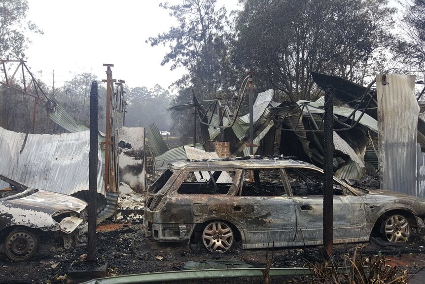 A burnt out car at a property owned by an RFS firefighter at Dondingalong, NSW.