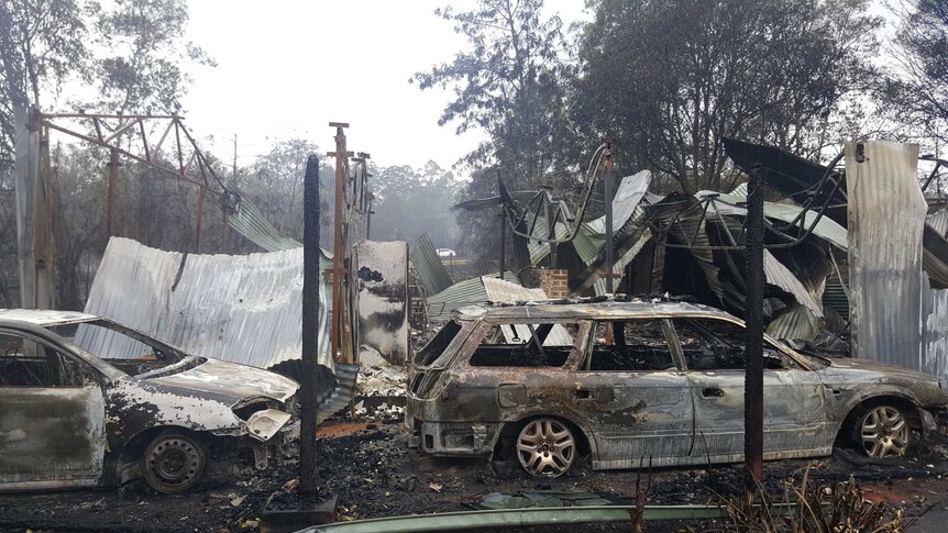A burnt out car at a property owned by an RFS firefighter at Dondingalong, NSW.