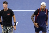 Thanasi Kokkinakis and Nick Kyrgios walk on the court during a US Open doubles match.