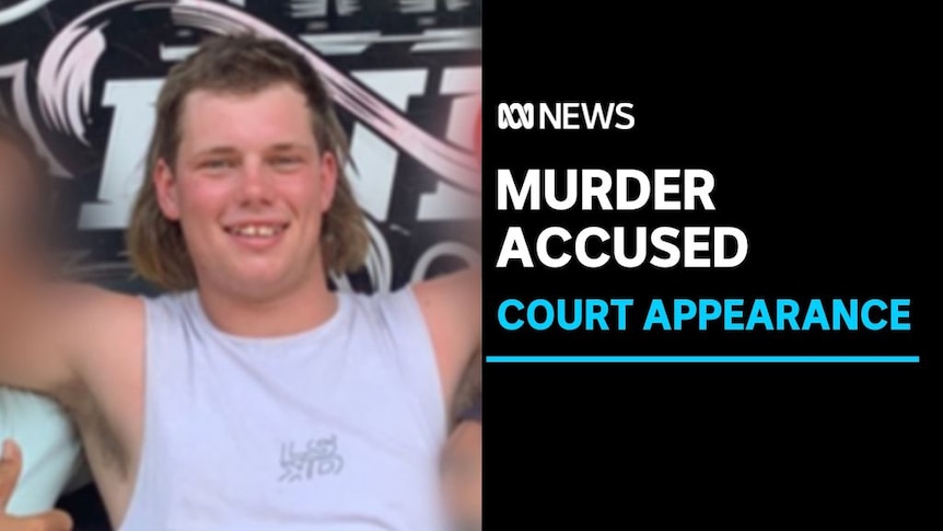 Murder Accused, Court Appearance: A man with two others. The two on either side if him are blurred.