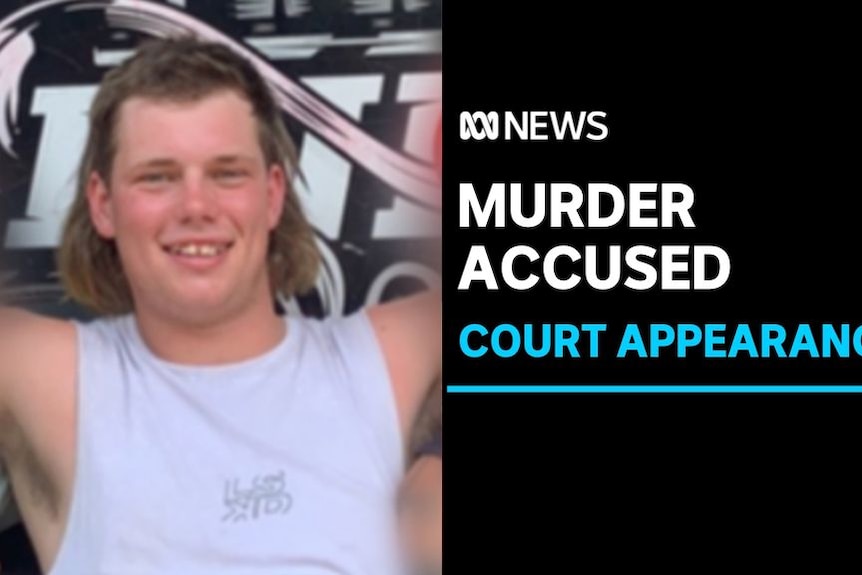 Murder Accused, Court Appearance: A man with two others. The two on either side if him are blurred.