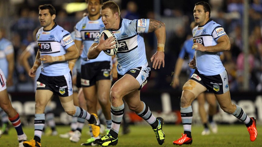 Luke Lewis runs for Cronulla against the Sydney Roosters in round 24, 2013 at Shark Park.