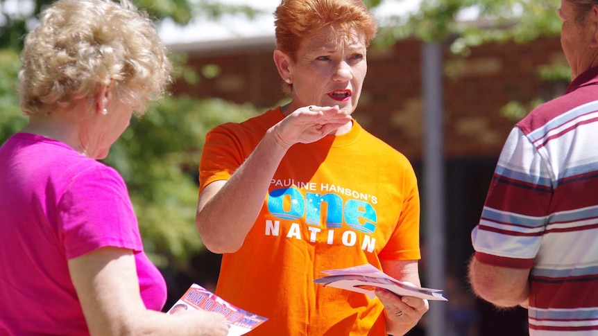 Pauline Hanson hands out how-to-vote cards while campaigning for the WA election.