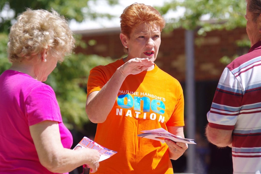 Pauline Hanson hands out how-to-vote cards while campaigning for the WA election.