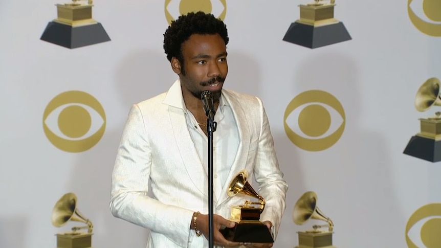 Donald Glover speaking to the press at the Grammys 2018