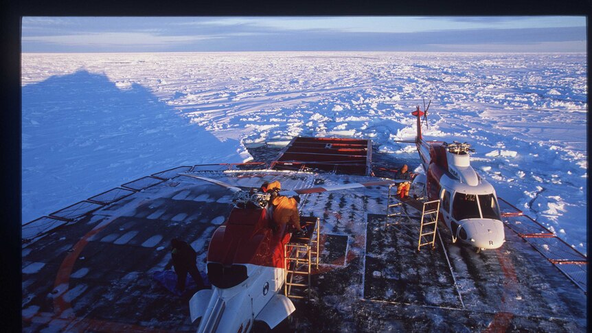 Blades are prepared on a helicopter aboard the Aurora Australis in 1999.