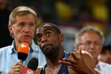 Tyson Gay is interviewed after failing to qualify for the men's 100m final at the Beijing Olympic on