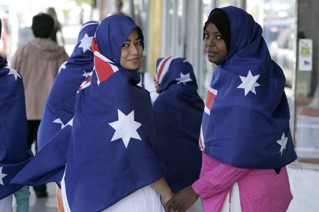 Young Muslim women modelling Australian flag hijabs.