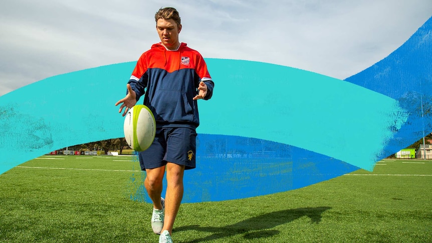 Man in rugby training gear kicks a rugby ball