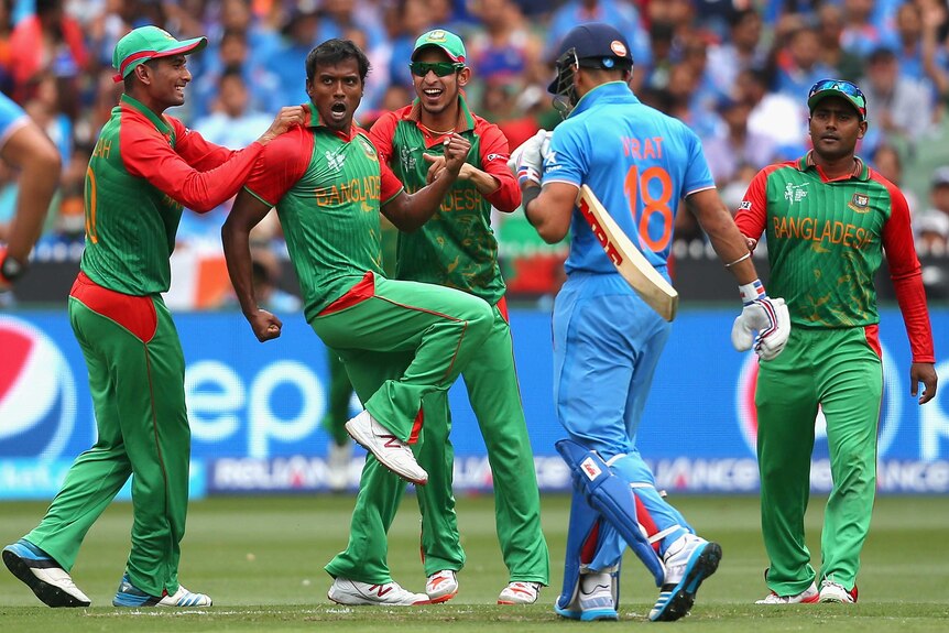Bangladesh's Rubel Hossain celebrates the wicket of India's Virat Kohli at the MCG.