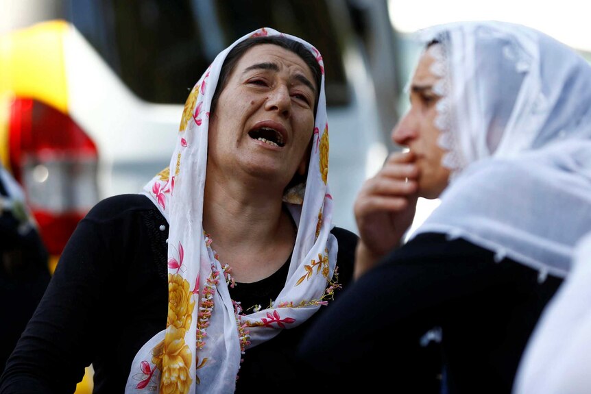 Woman cries outside Gaziantep hospital