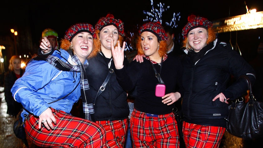 New Year revellers show off their tartan trousers