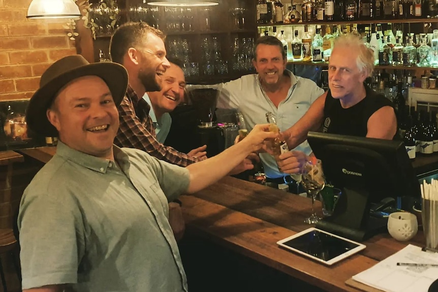 Alby Mangels dusts off his old bartending skills with fans at a World Safari Screening at the Lancefield Lodge in Victoria.