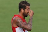 Swans return ... Lance Franklin leaves the field at the half-time break against the Power