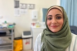 Umber Rind smiling in a headscarf in a medical centre