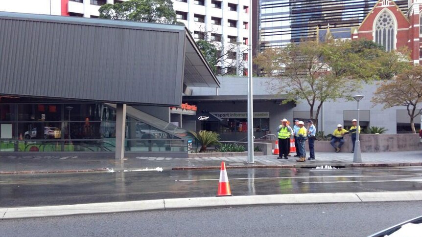 Police and Urban Utilities at site of burst water main in Brisbane's CBD on October 22, 2013