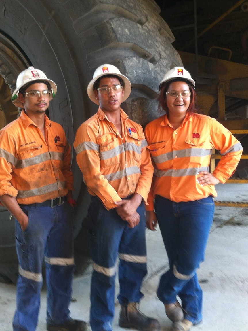 Three young apprentices in the workshop at Century Mine
