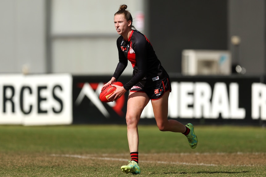 Brooke Brown runs with the ball