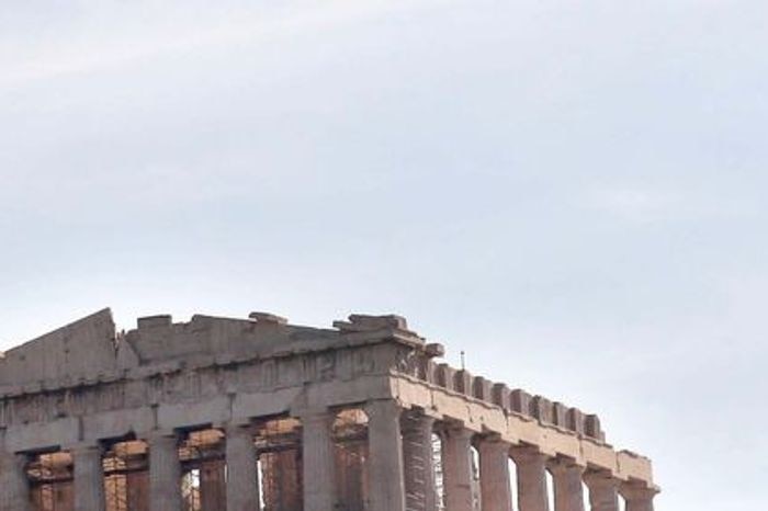 Giant banners protesting Greece's austerity measures hang near the Parthenon on Acropolis hill