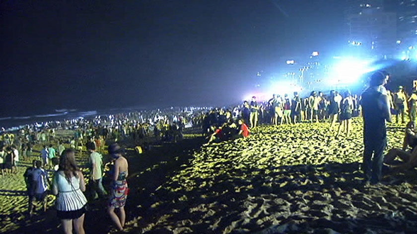 TV still of schoolies revellers on beach at night at Surfers Paradise on Gold Coast in 2009