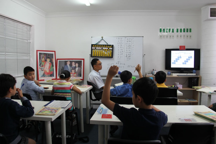 Primary school students use the abacus at this afterschool maths class in Chatswood.