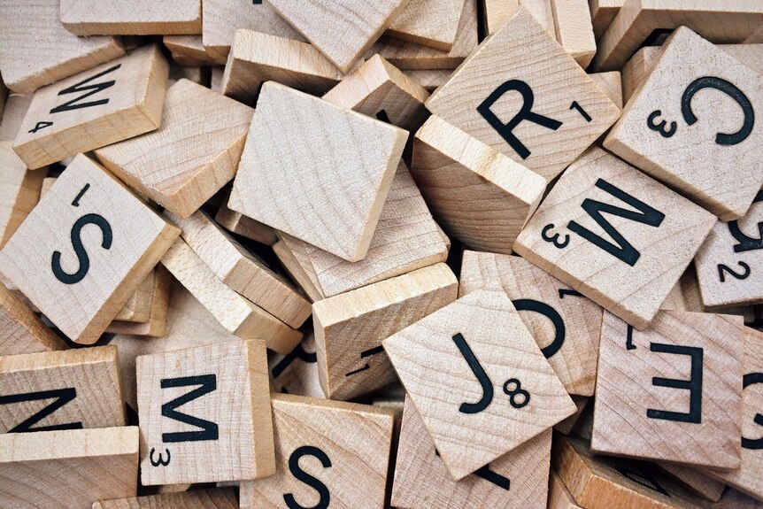 A pile of wooden letter tiles.