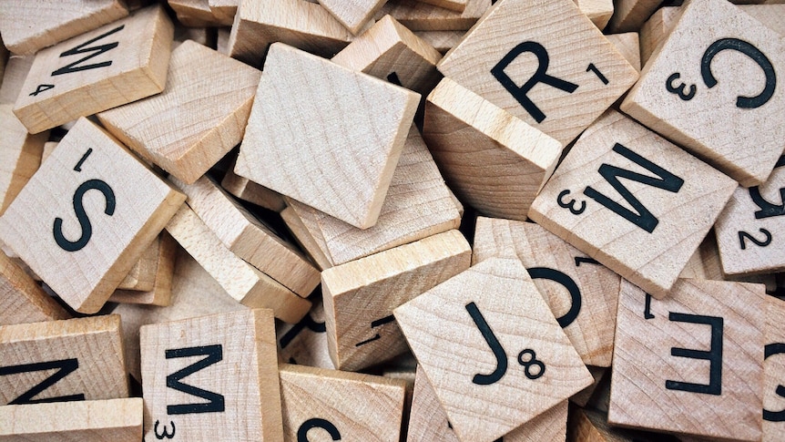 A pile of wooden letter tiles.