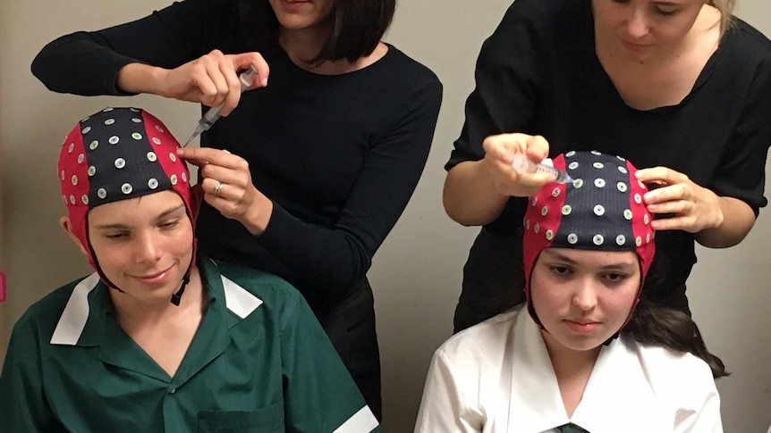 Students fitted with brain activity monitors