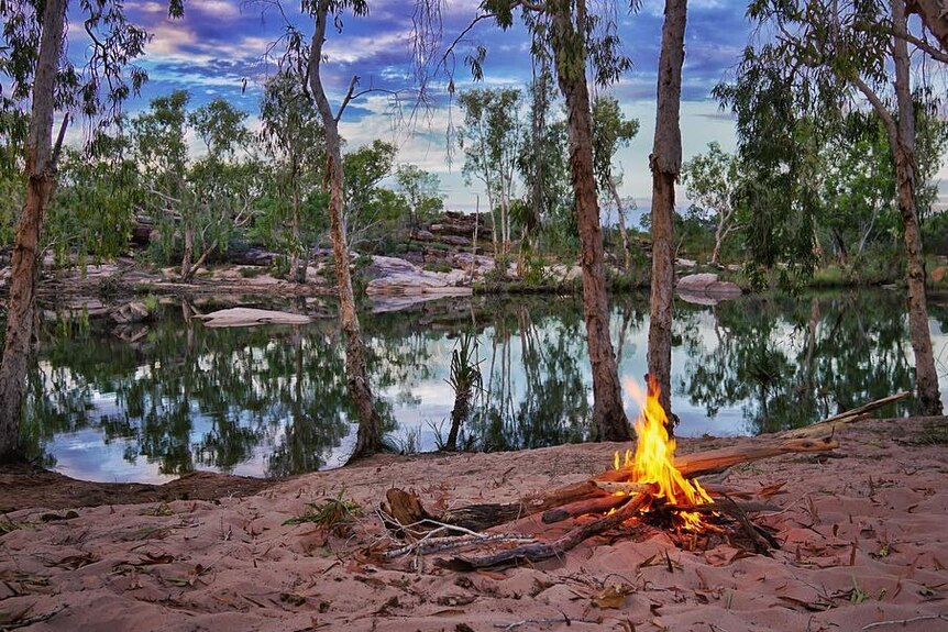 A camp fire by a billabong in the King Leopold Ranges, WA