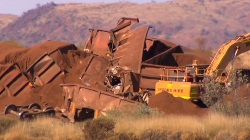 Vision shows the twisted and mangled remains of a runaway train derailed by BHP