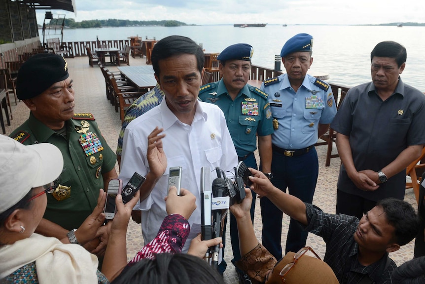 Indonesian president Joko Widodo speaks to reporters in Sorong