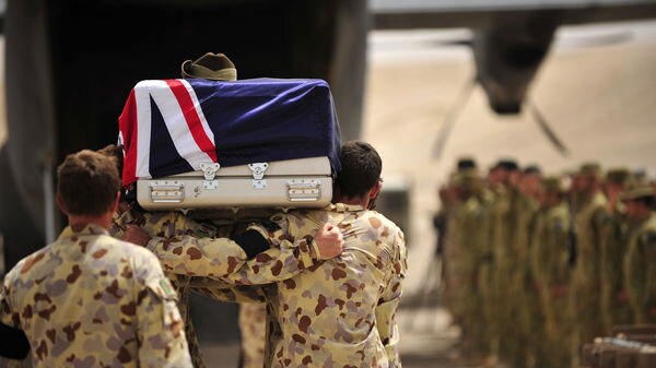 Lance Corporal Jared MacKinney is farewelled at a ramp ceremony.