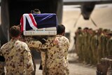 Lance Corporal Jared MacKinney is farewelled at a ramp ceremony.