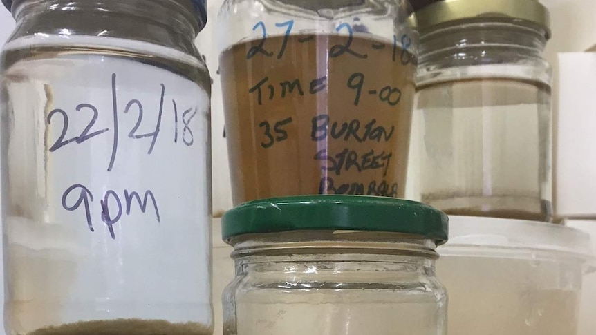 Jars of dirty water samples from Bombala