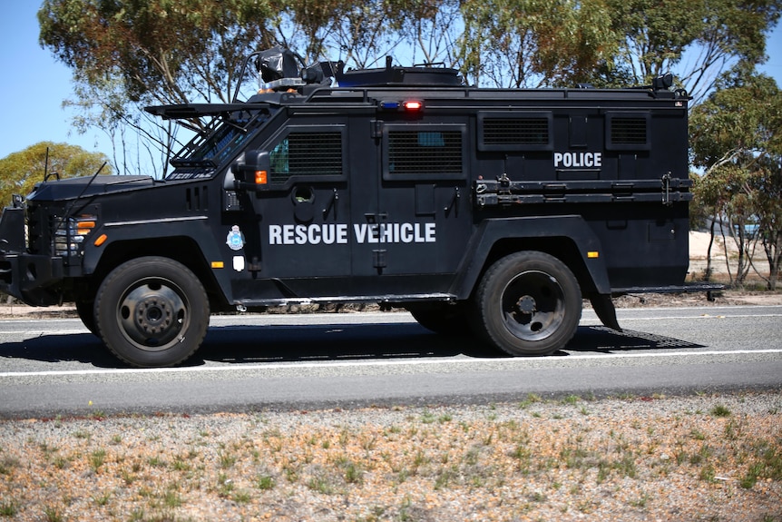 A heavy police vehicle that says 'rescue vehicle' on the side. 